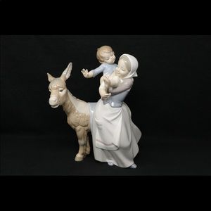 Lladro Spanish porcelain. Lady with child and donkey